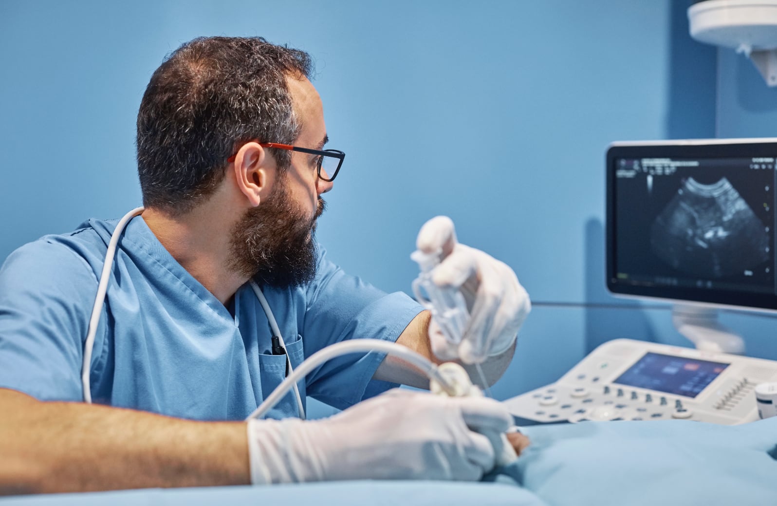 Ultrasound Guided Intervention Staring At Monitor