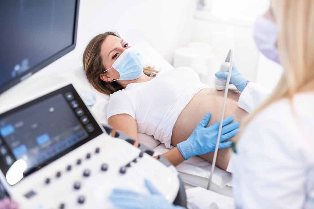 Pregnant Woman On Ultrasound Picture Id1251576068